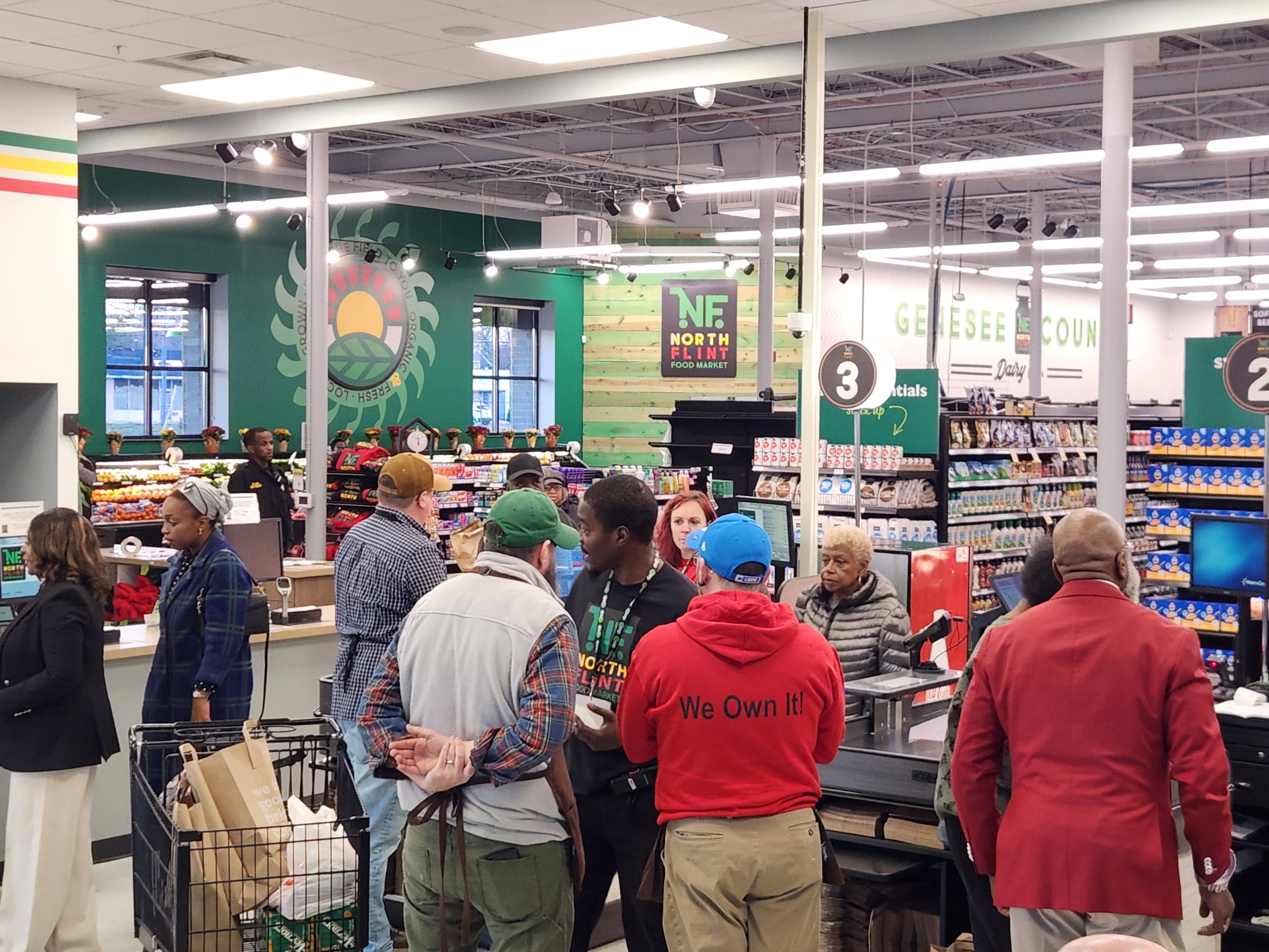 Shoppers checking out at the register inside North Flint Food Market