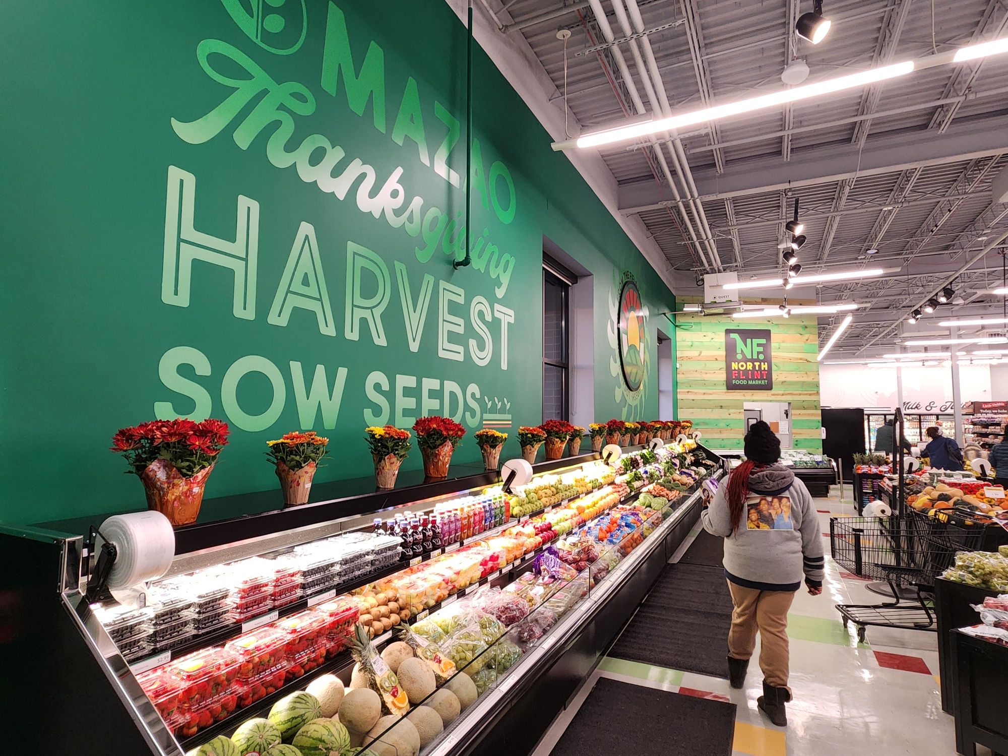 Shoppers in the produce section of NFFM