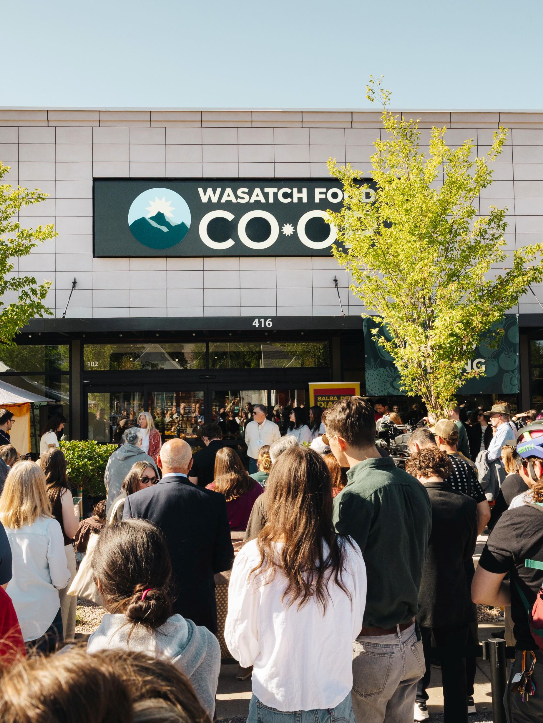 Supporters gather in front of Wasatch Food Co-op at its Grand Opening